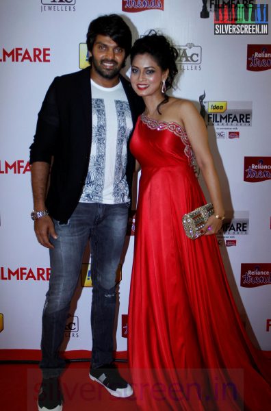 Actor Arya and Pooja at 61st Filmfare Awards 2014