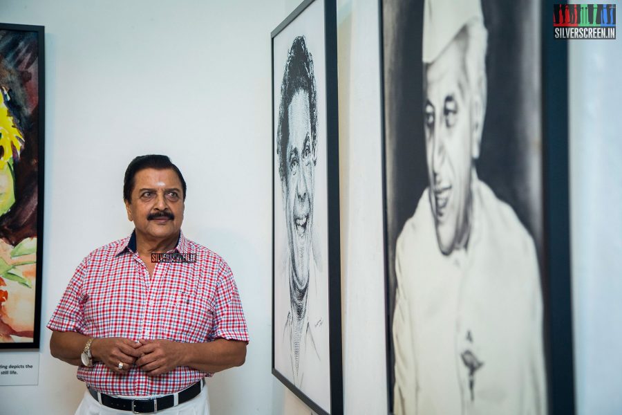 Sivakumar next to the portraits of NS Krishnan and Jawaharlal Nehru on Day 2 of the exhibit