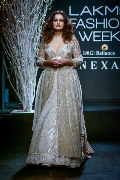 Mumbai:Actress Dia Mirza display the creation of fashion designe