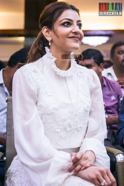 Kajal Aggarwal is in pristine whites at the launch of 'Paris Paris'. She also wears one of those lovely ear jacket earrings that are in vogue. Pic: Sriram Narasimhan