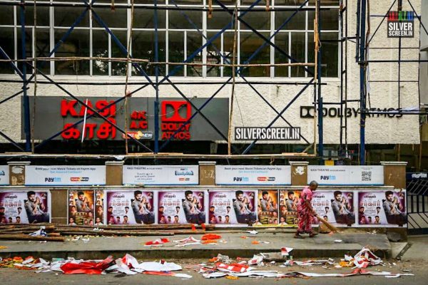 A photo of kasi theatre in Chennai showing film banners being torn 