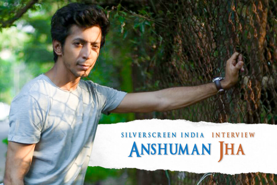 Actor Anshuman Jha standing against a tree